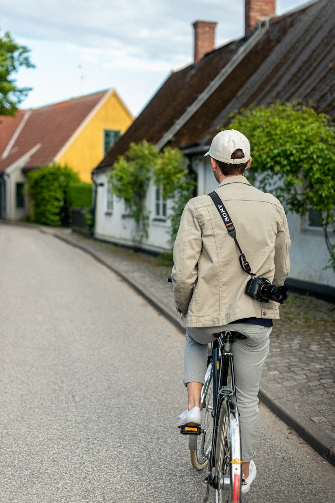 Street life in a small Danish provincial town with bicycles and pastel houses